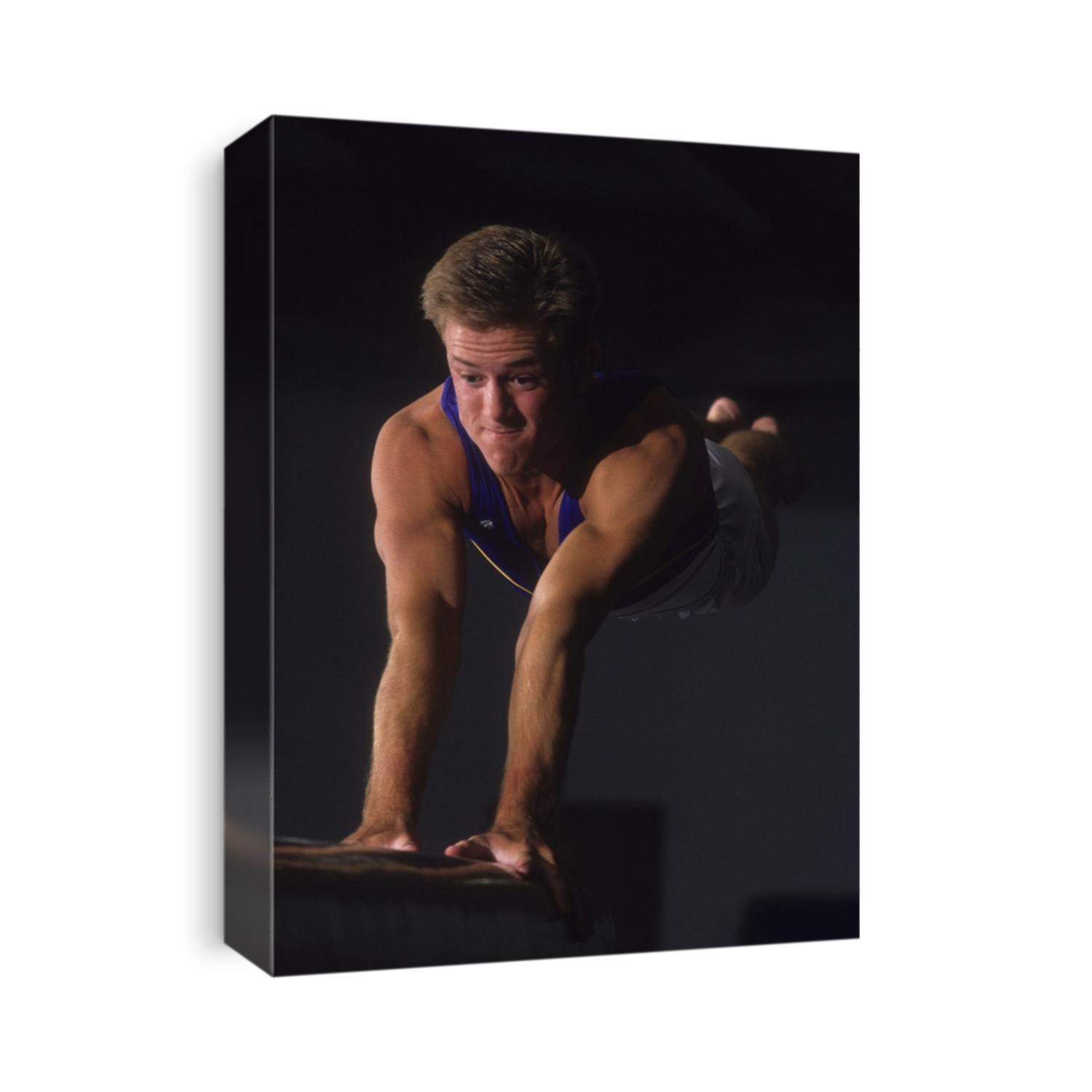 Male gymnast on the vault.
