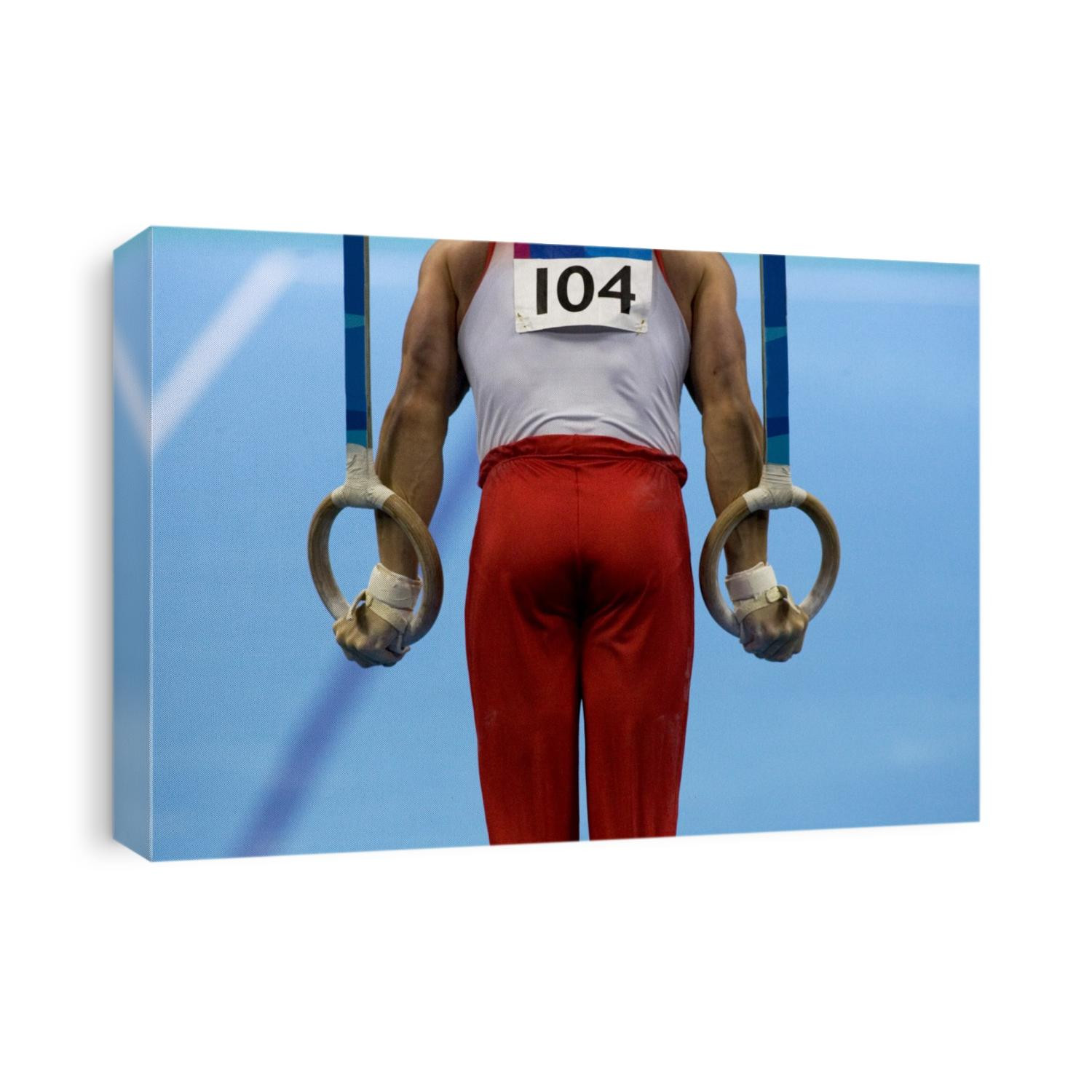 Detail of male gymnast competing on the rings in men's qualification_2004 Olympic Summer Games, Athens, Greece. August 14, 2004