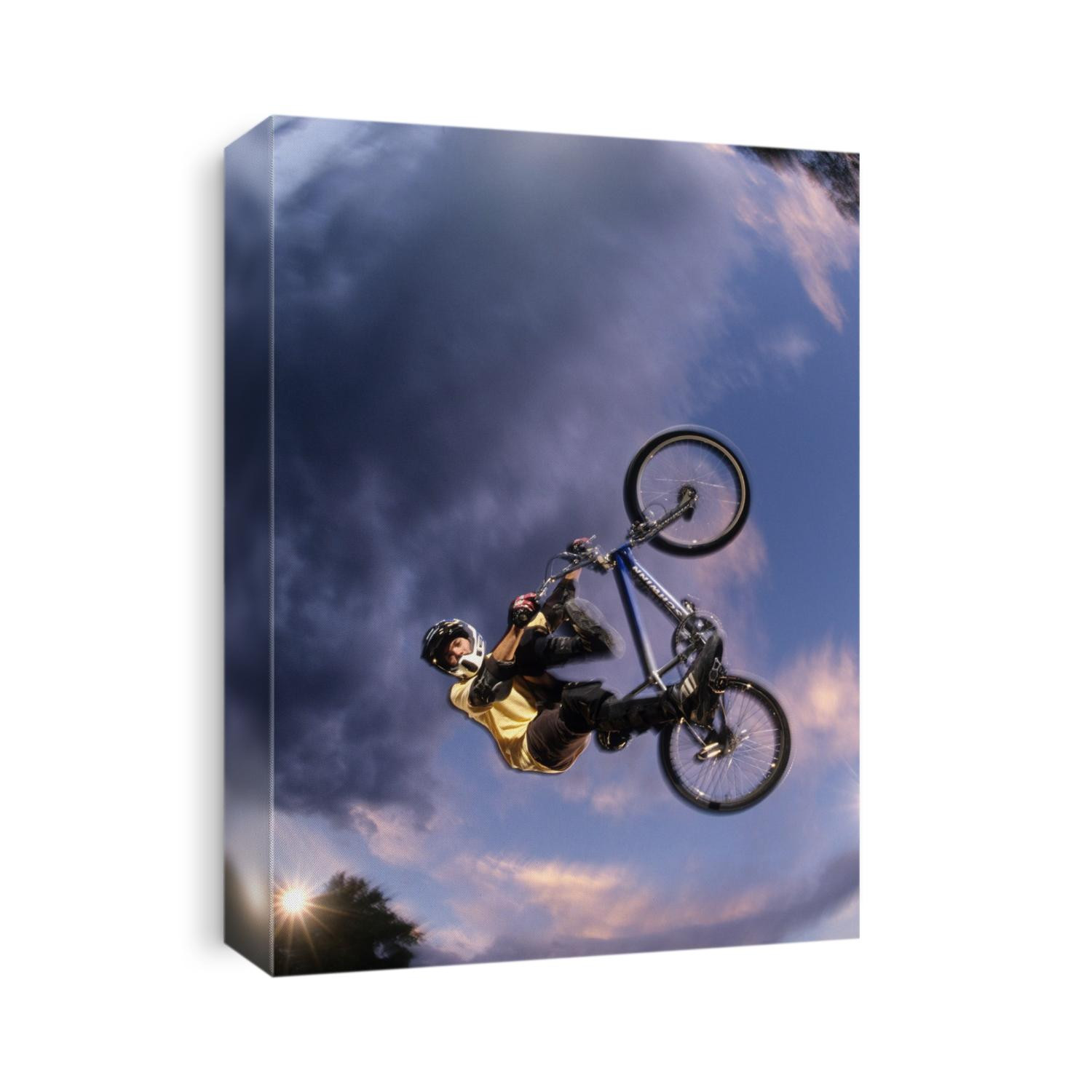 BMX cyclist flys over the vert.