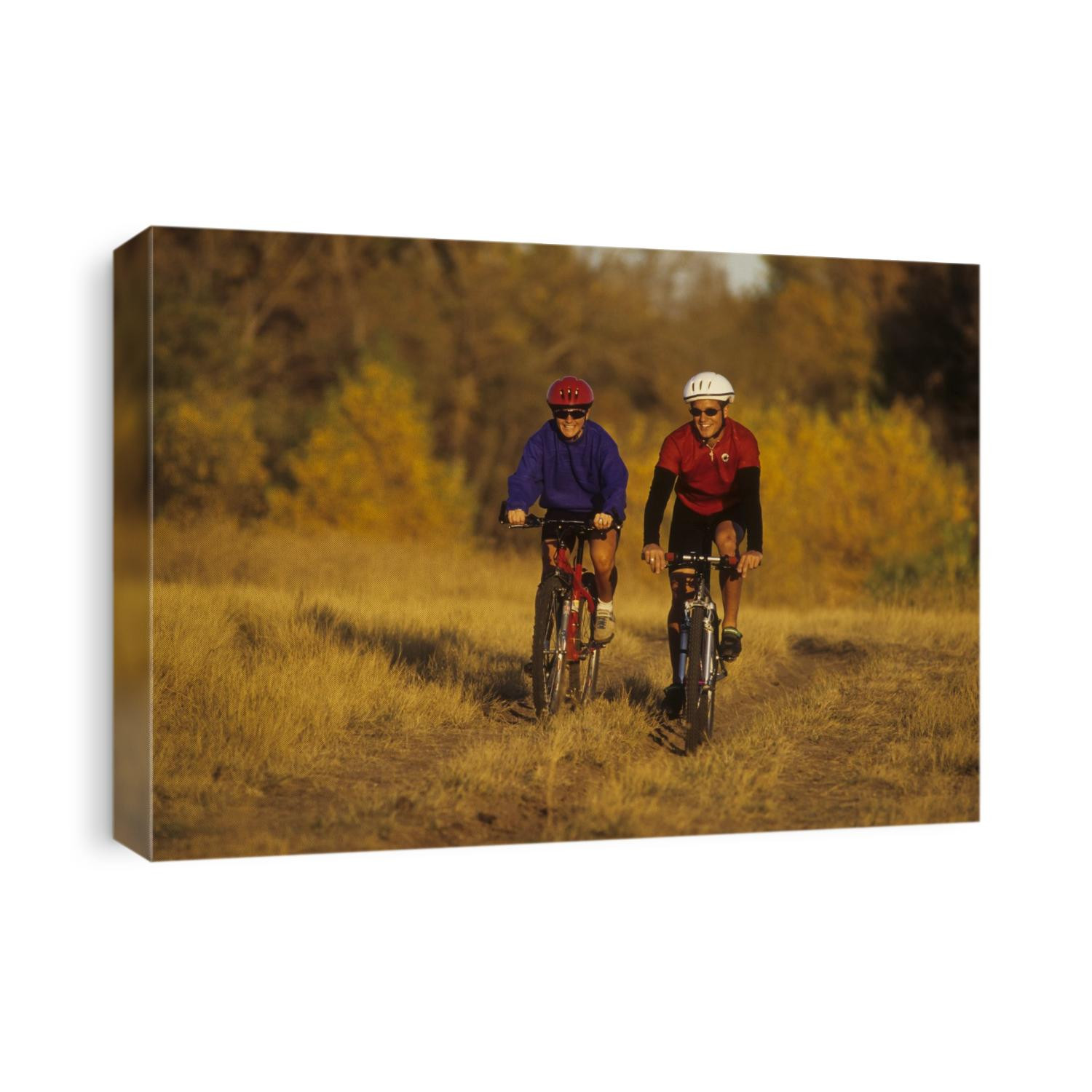 Couple mountain biking in Fall.