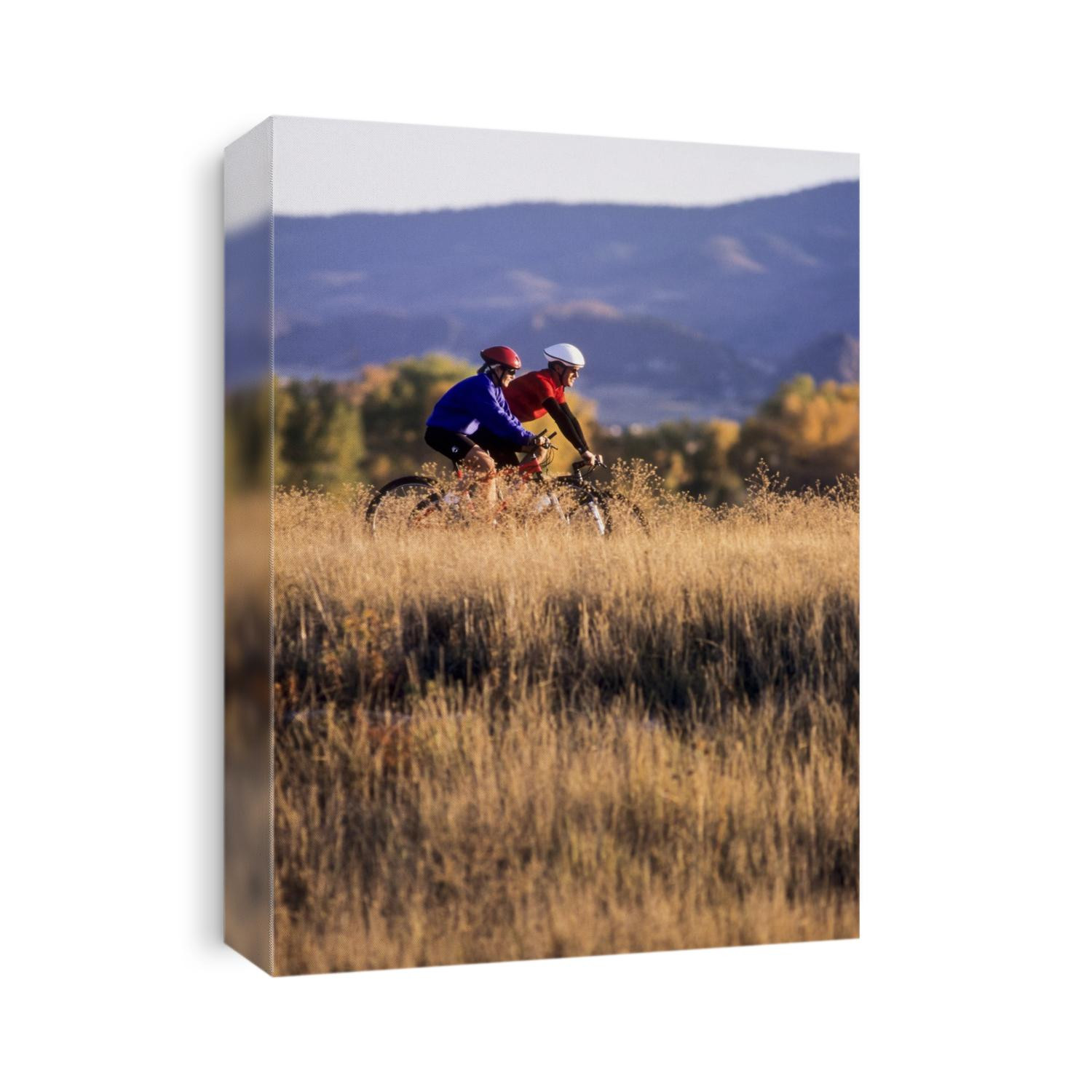 Couple mountain biking in Fall.