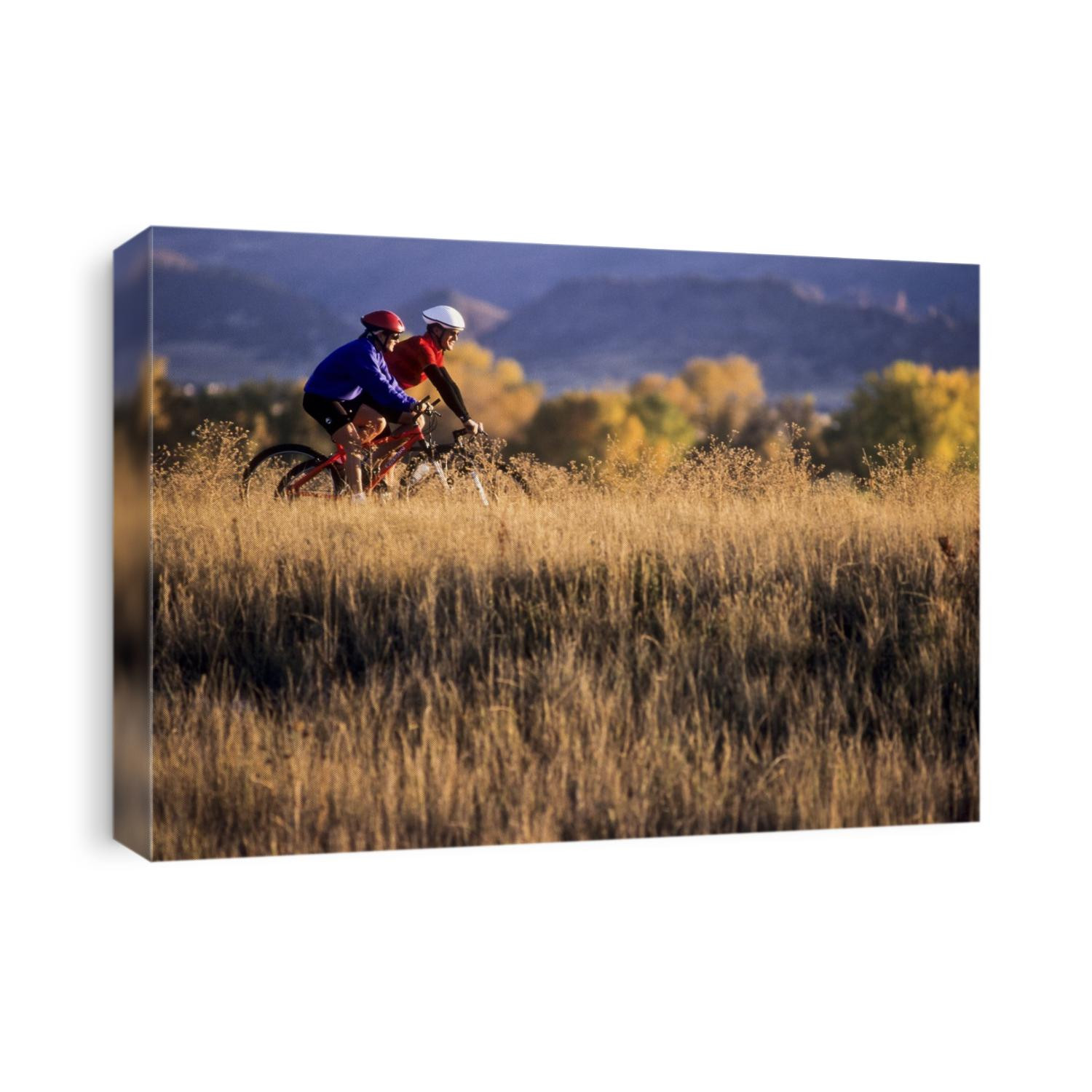 Couple mountain biking in Fall.