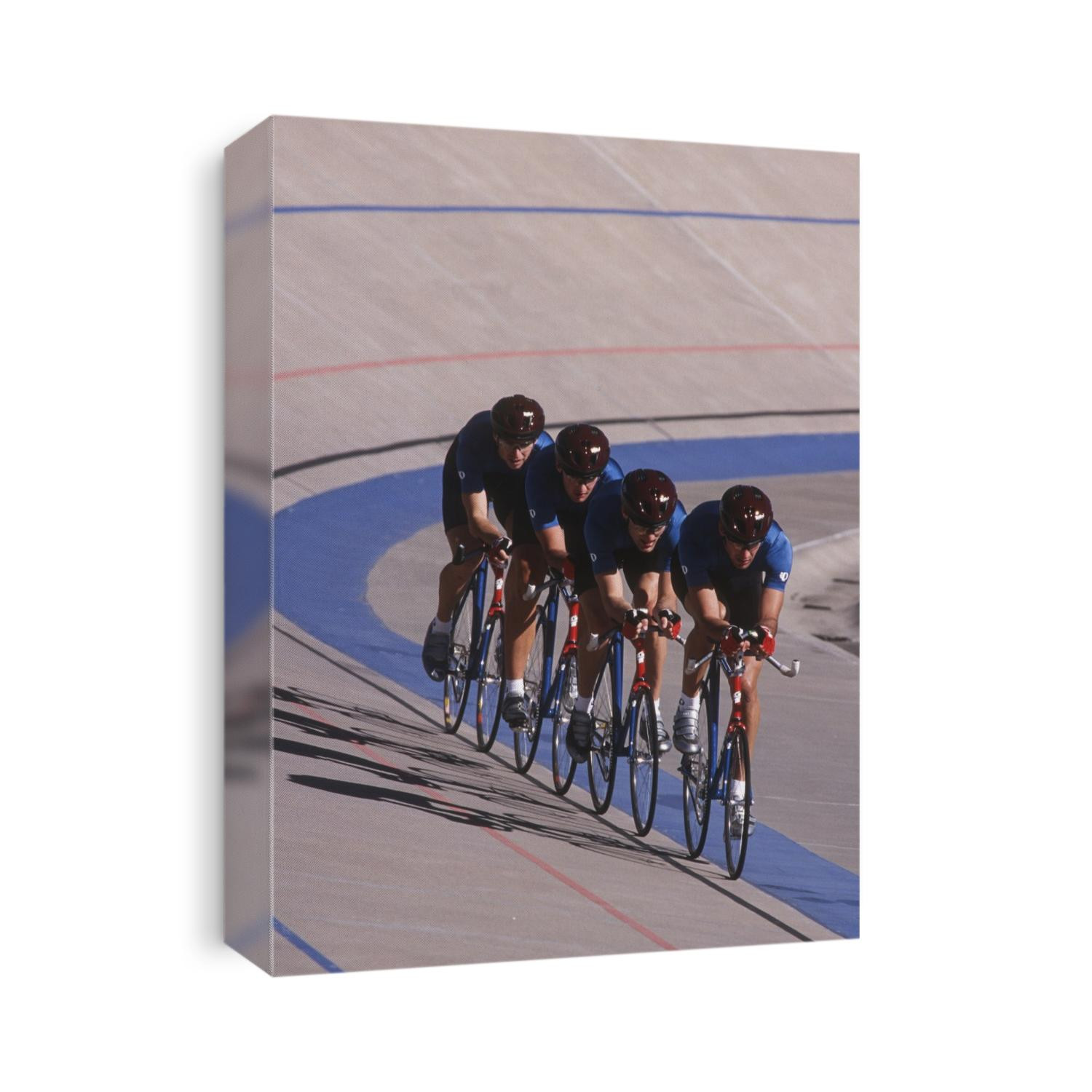 Male cycling team on the velodrome.