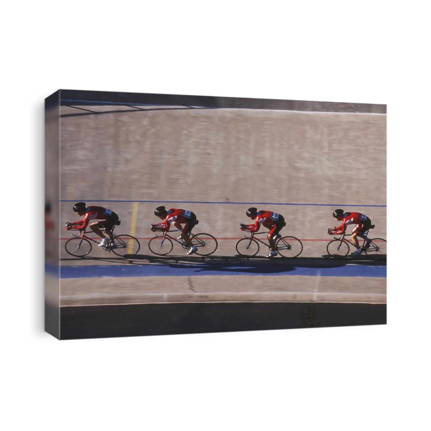 Male cycling team on the velodrome.