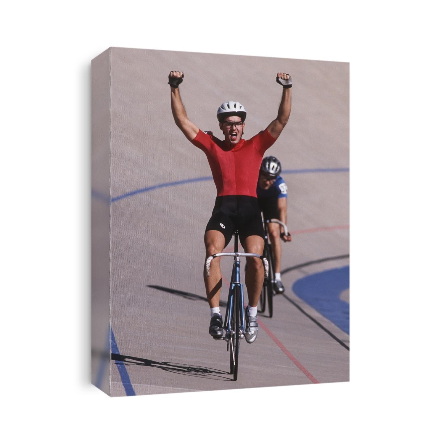 Male cyclist winning on the velodrome.