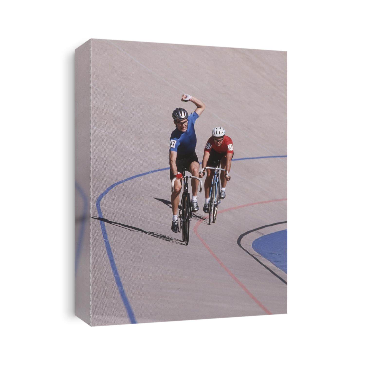 Male cyclist winning on the velodrome.