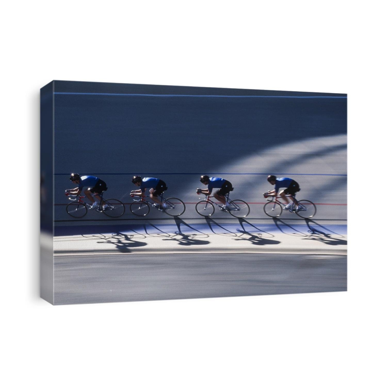Male cycling team on the velodrome.