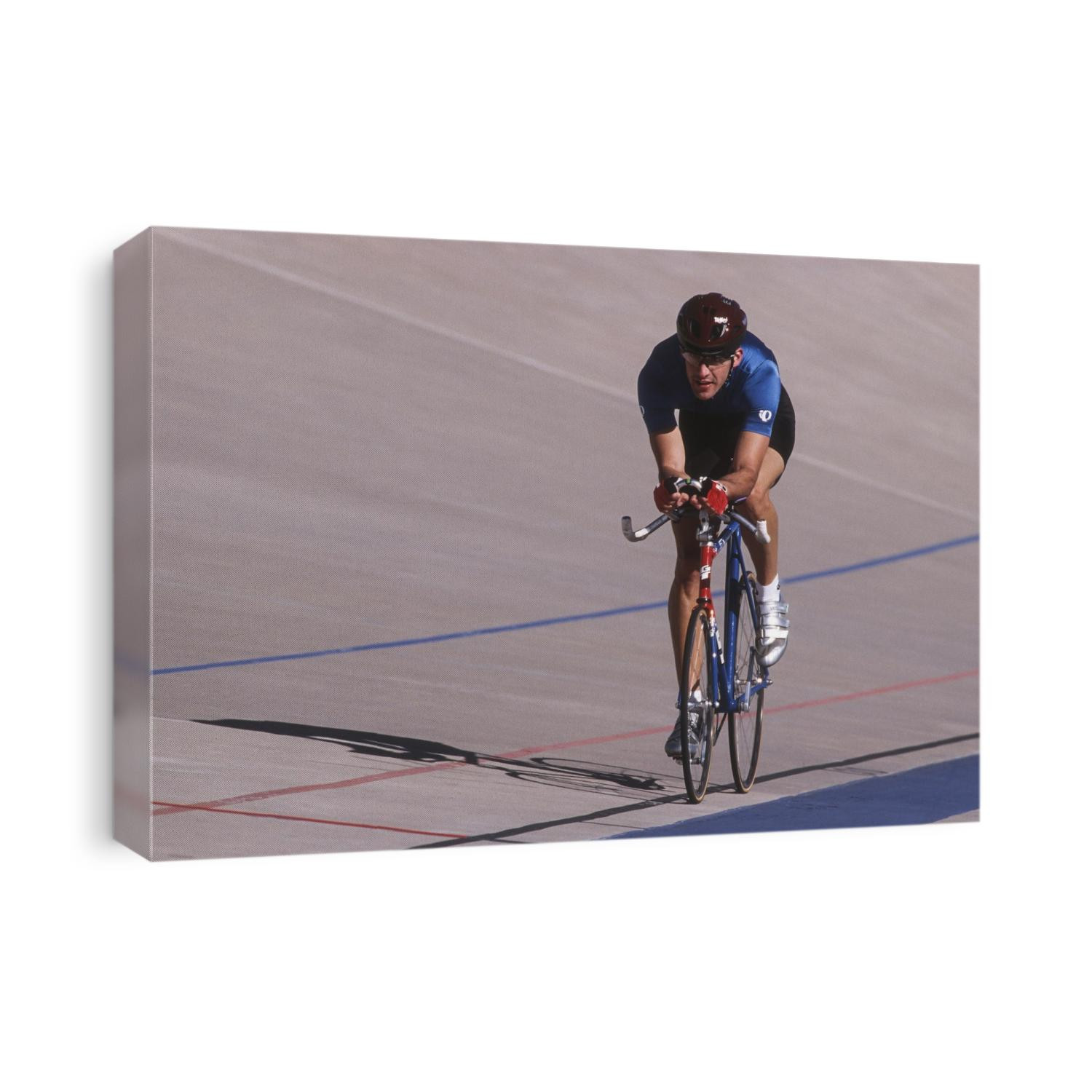 Male cyclist competing on the velodrome.
