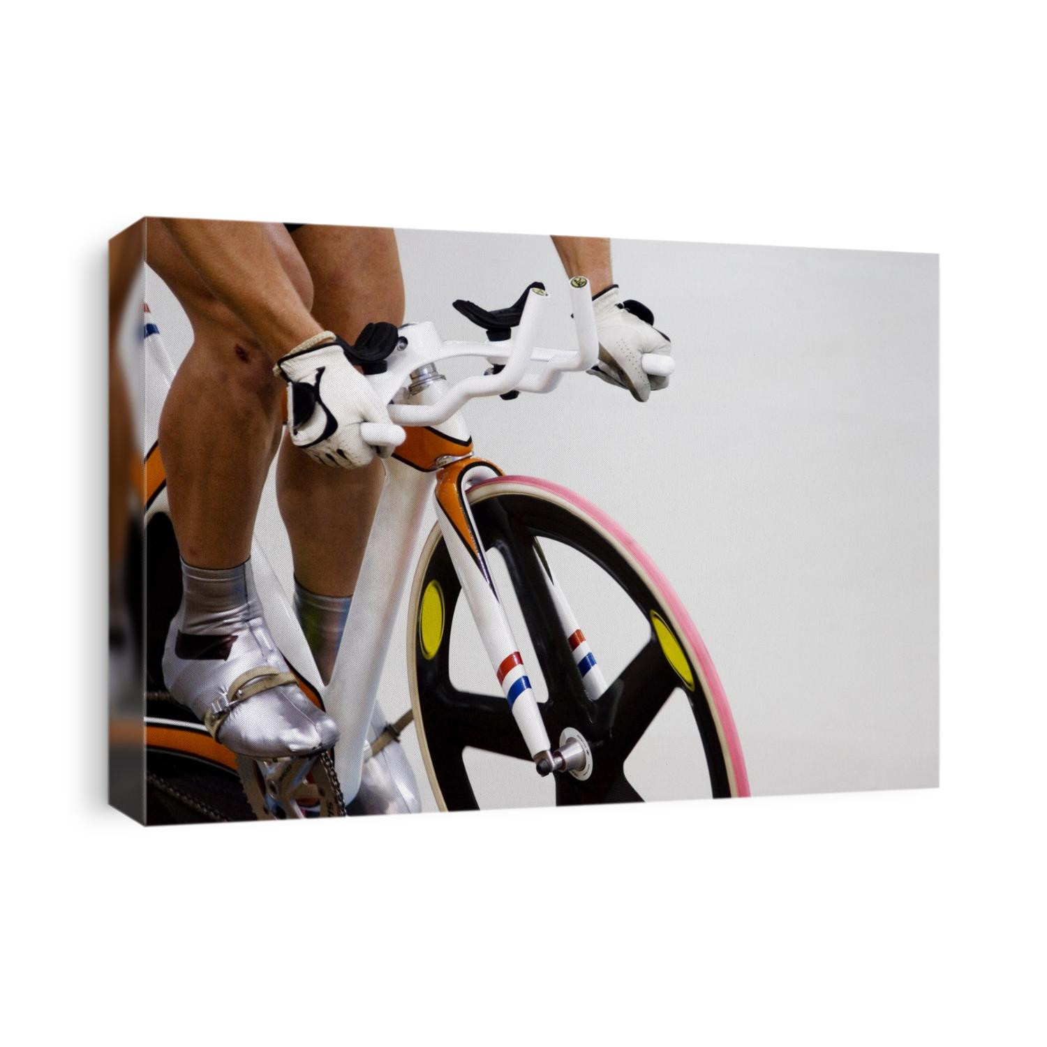 Detail of cyclist racing on the velodrome track.
