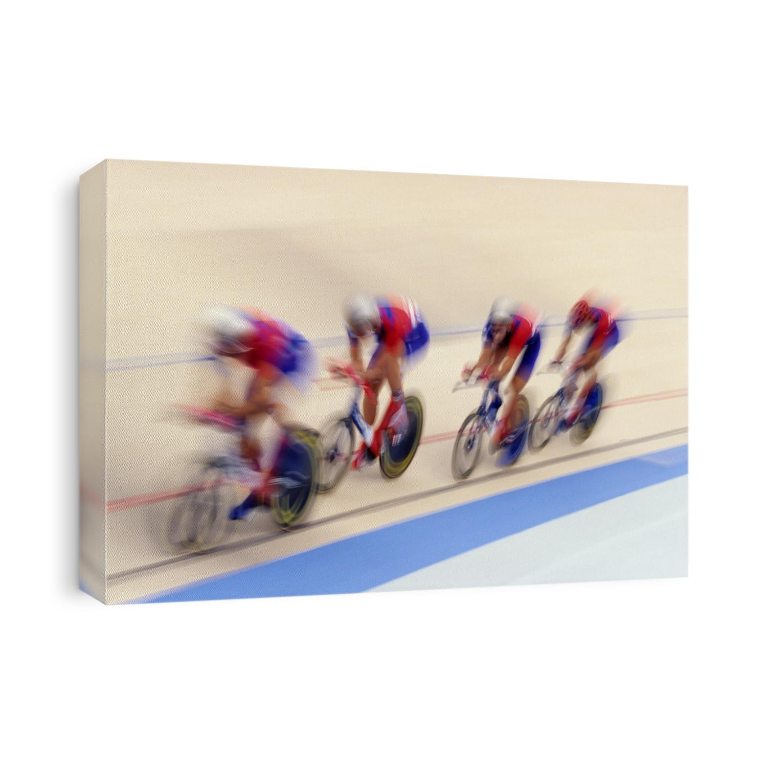 Cycling team competing on the velodrome.