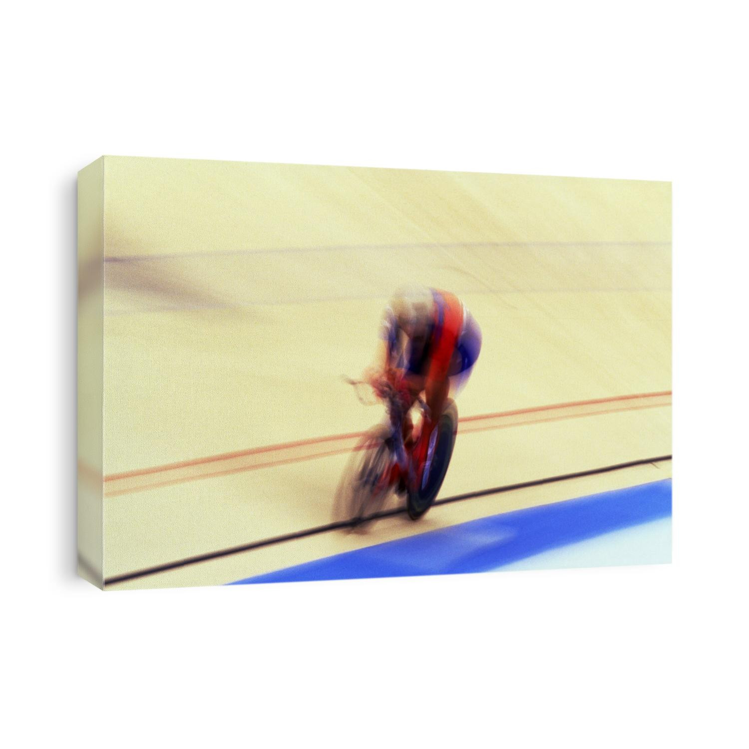Blurred action of cyclist on the track.