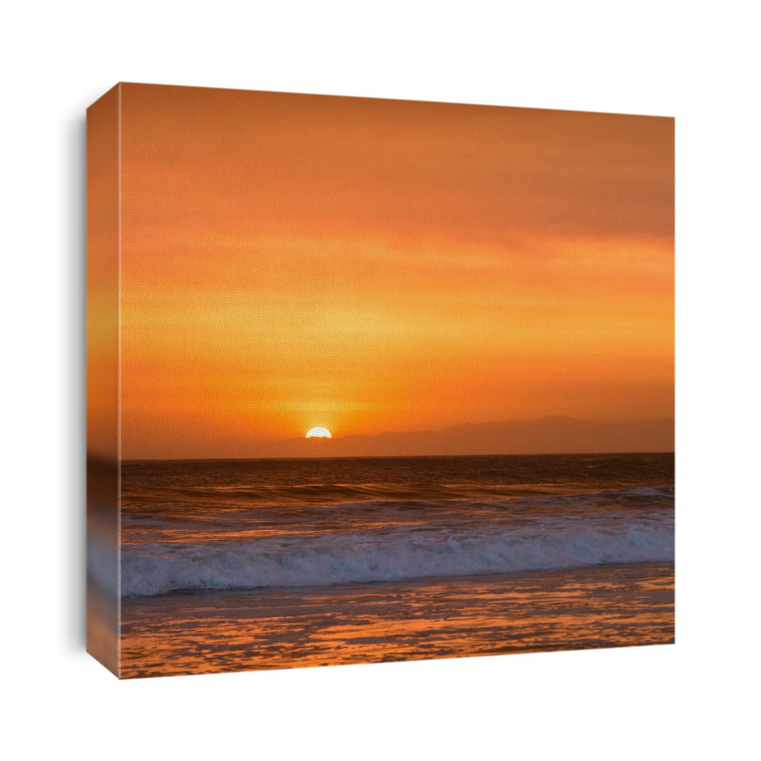 The sun sets just behind Malibu point