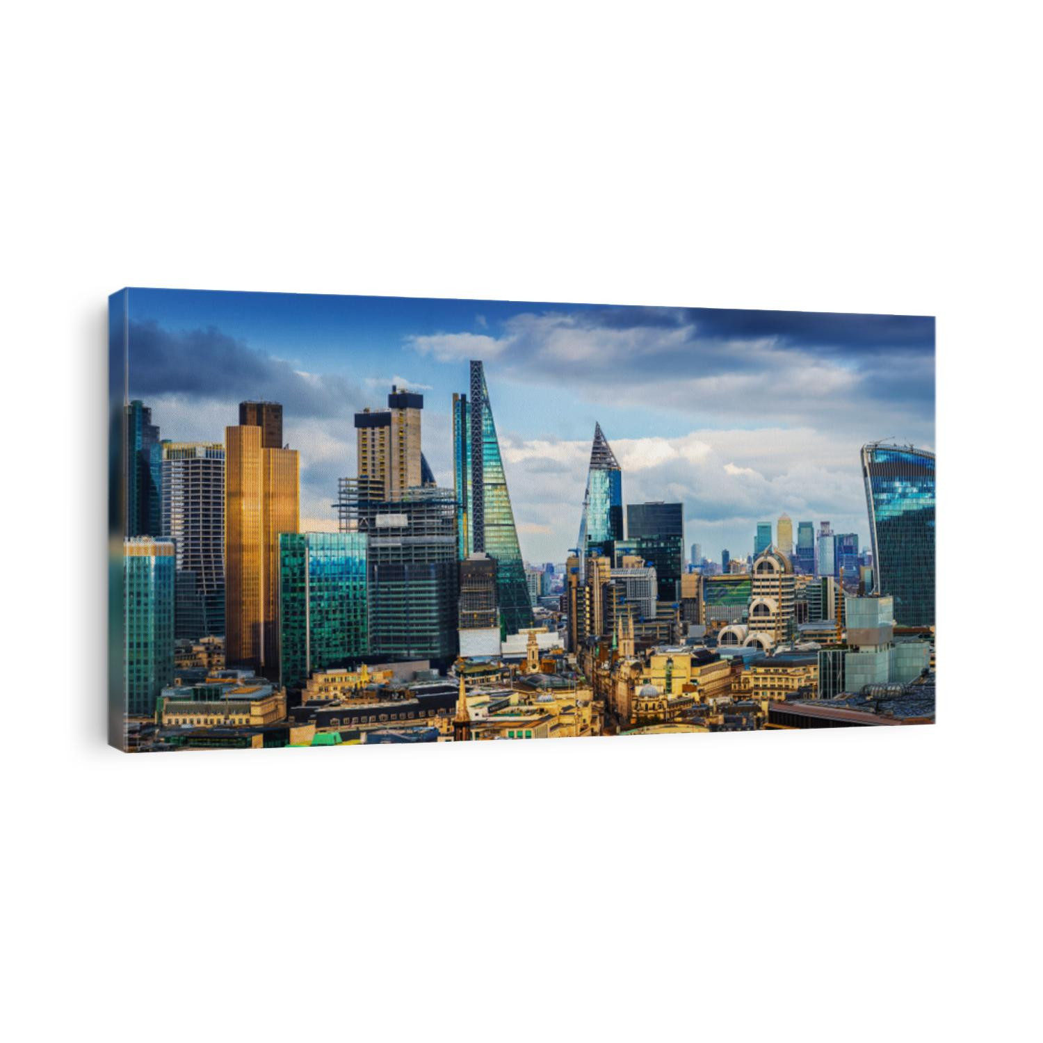 London, England - Panoramic skyline view of Bank and Canary Wharf, central London's leading financial districts with famous skyscrapers at golden hour sunset with blue sky and clouds