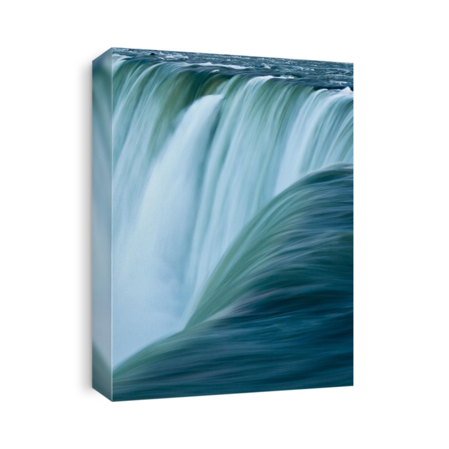 Close up of water rushing over Horseshoe Falls, Niagara Falls, Ontario, Canada