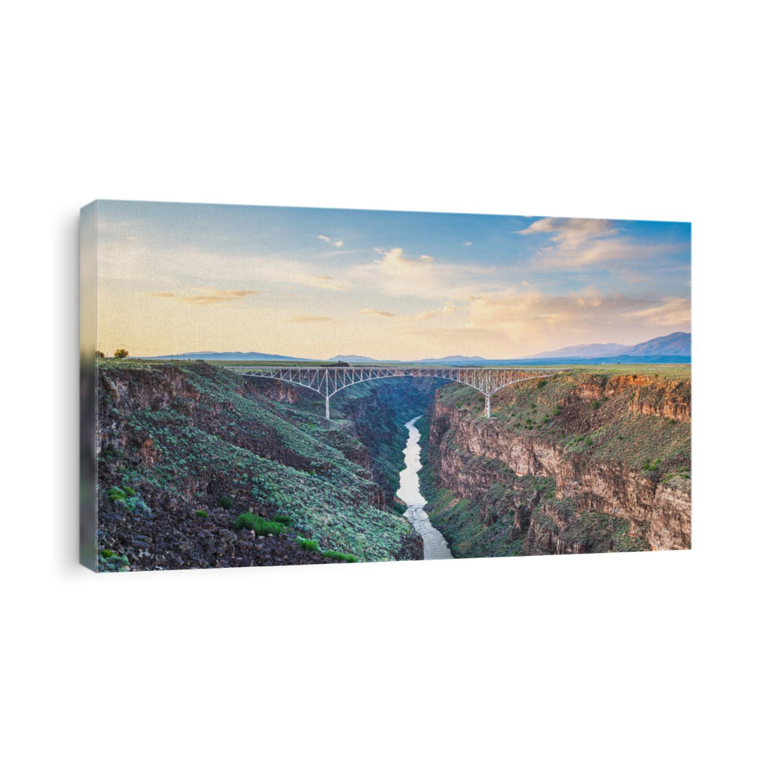 Taos, New Mexico, USA at Rio Grande Gorge Bridge over the Rio Grande at dusk.