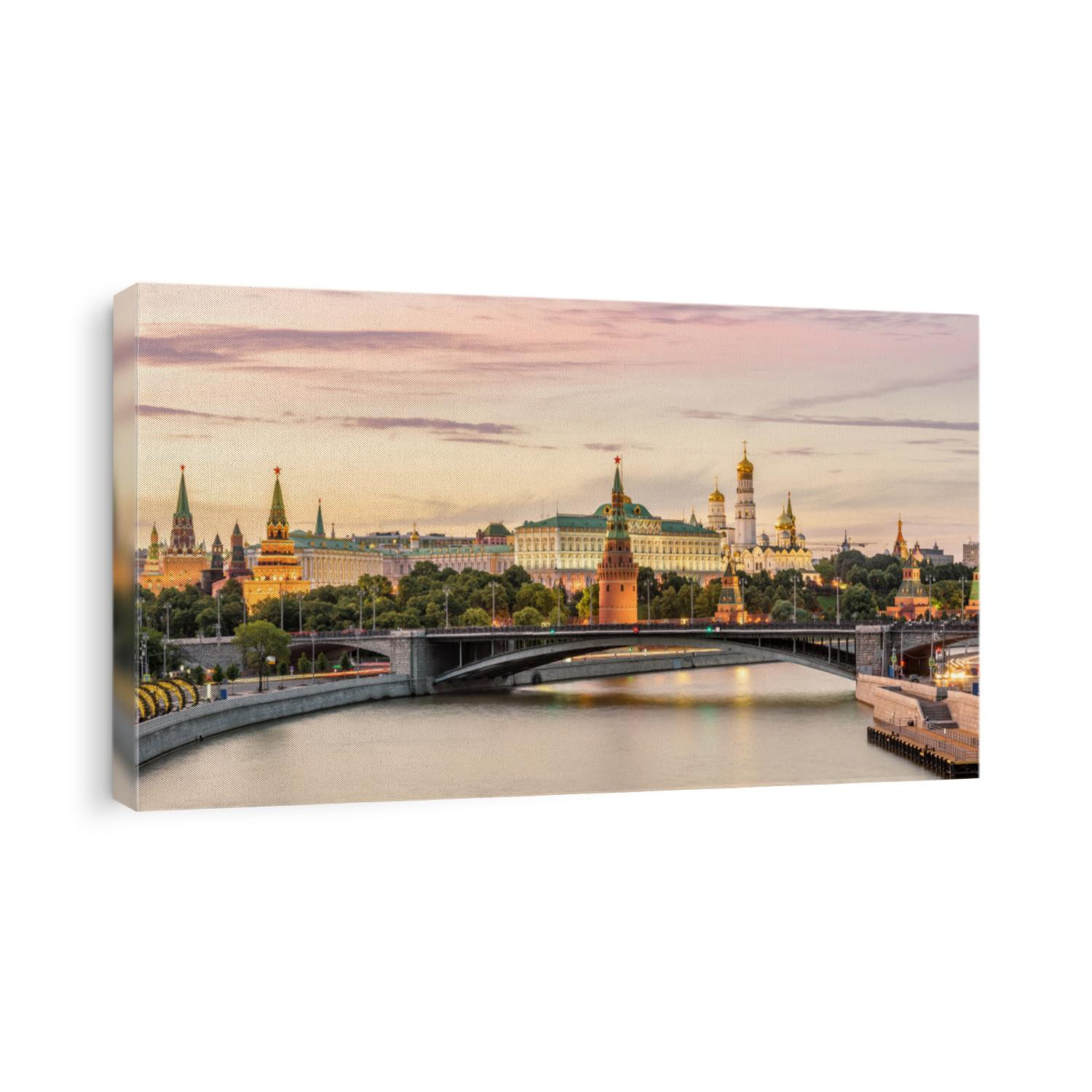 Moscow Kremlin at Moskva River, Russia. Panorama of old Moscow in summer evening. Scenic warm view of the ancient Moscow Kremlin at sunset. Beautiful cityscape of the famous Moscow center. 