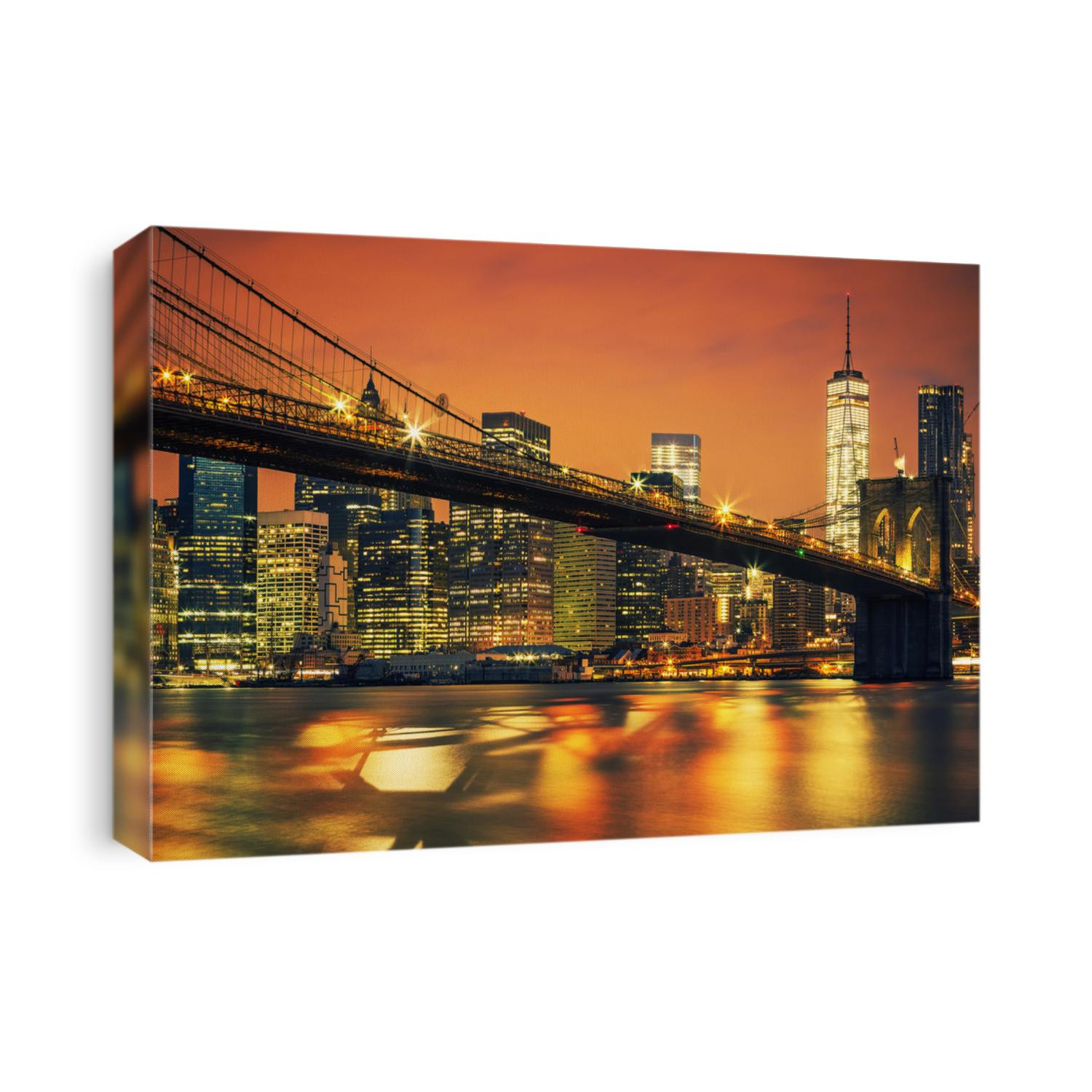 New York City Manhattan midtown at sunset with Brooklyn Bridge.