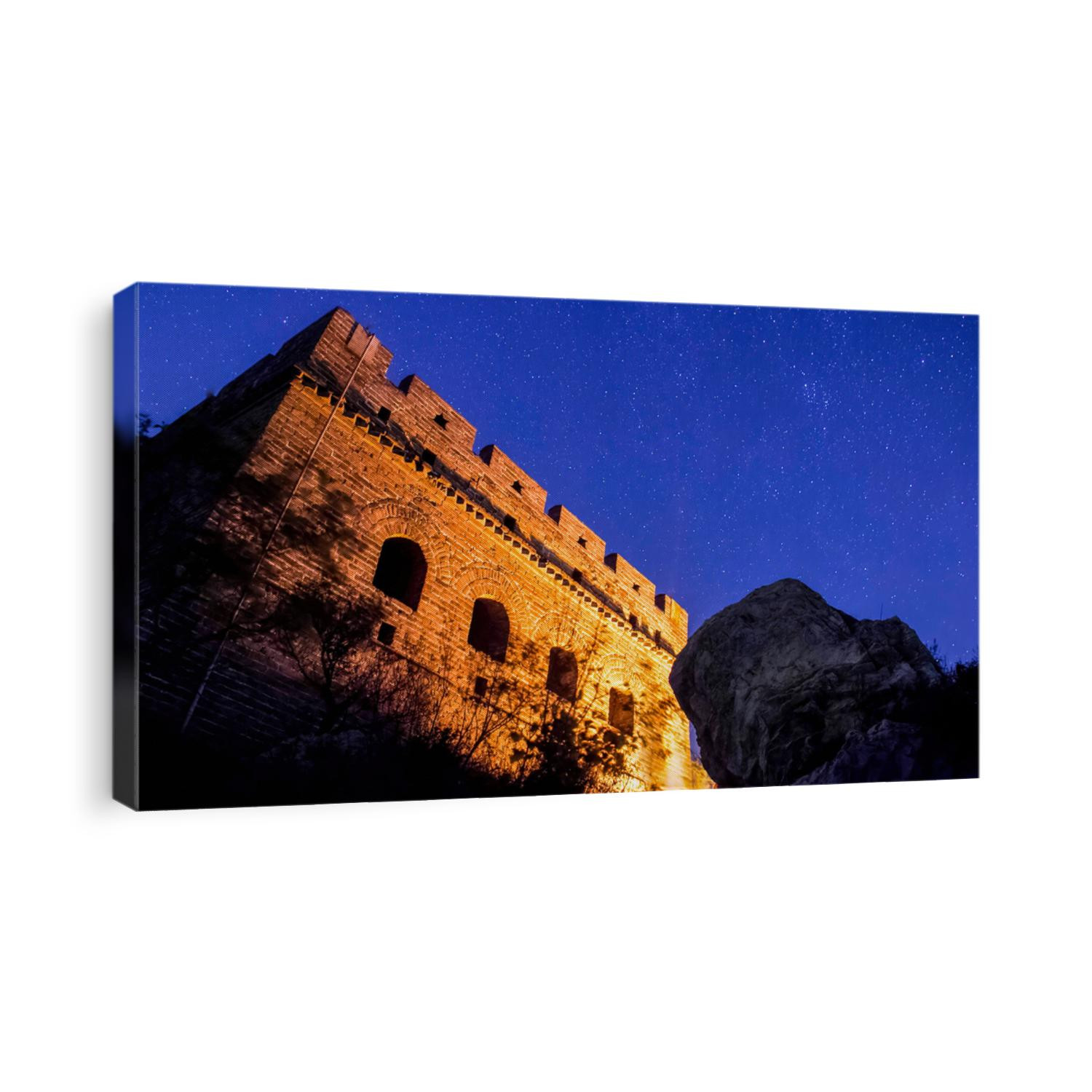 the great wall of China Beijing while camping captured a starry night with long exposure tower lit by bonfire