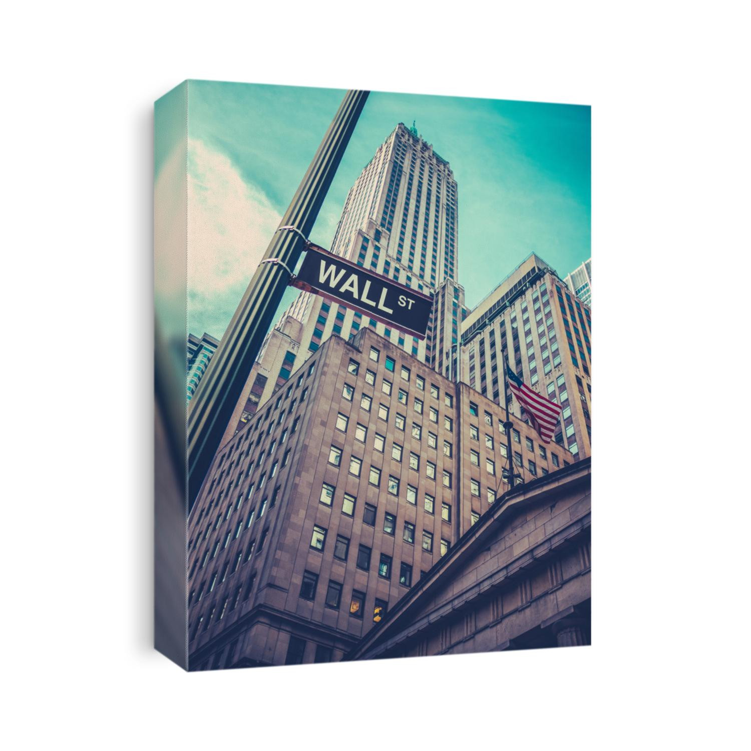 A Sign For Wall Street In Lower Manhattan, New York, With Skyscrapers Towering Behind