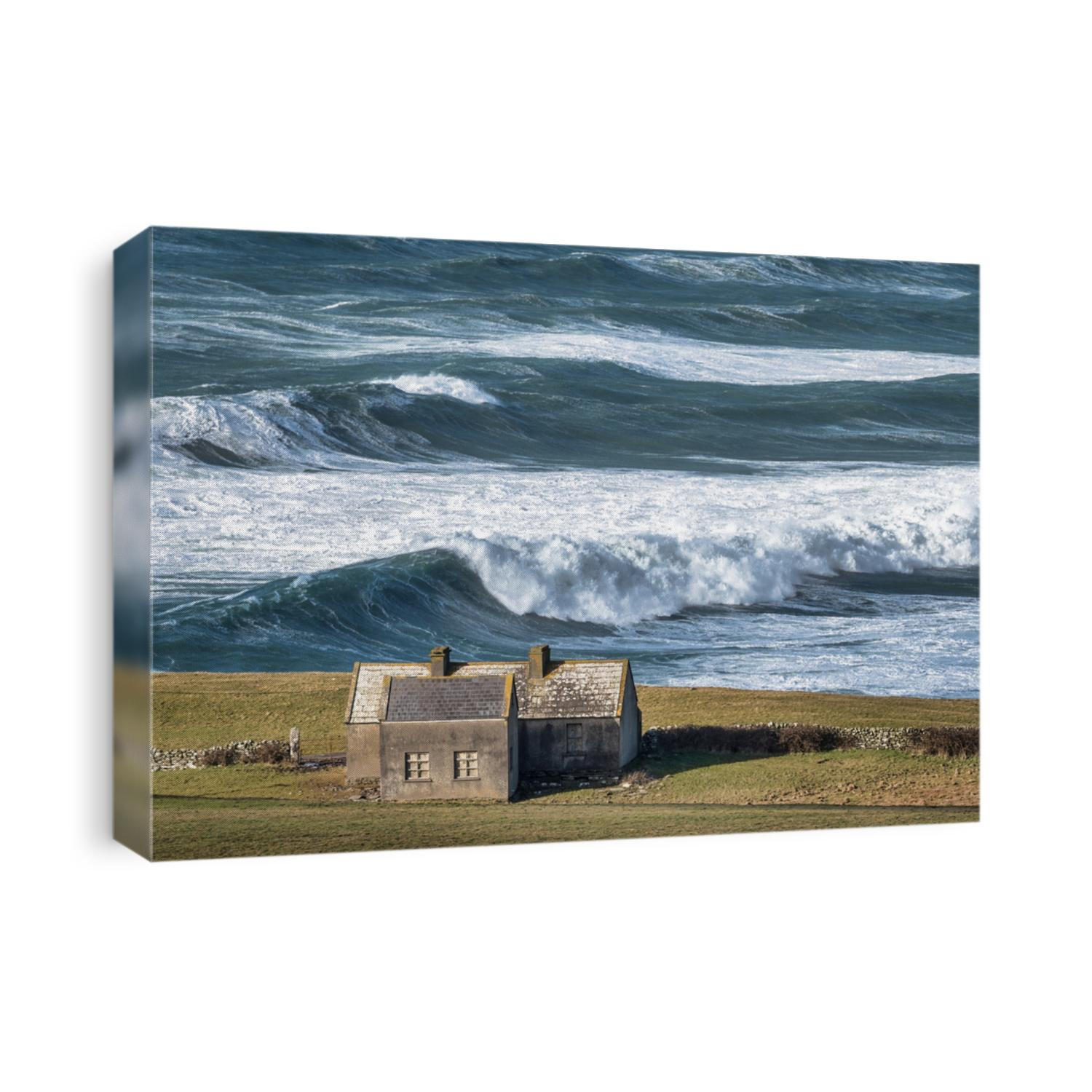 Rough sea with large waves on the Irish coastline in County Clare near the Cliffs of Moher