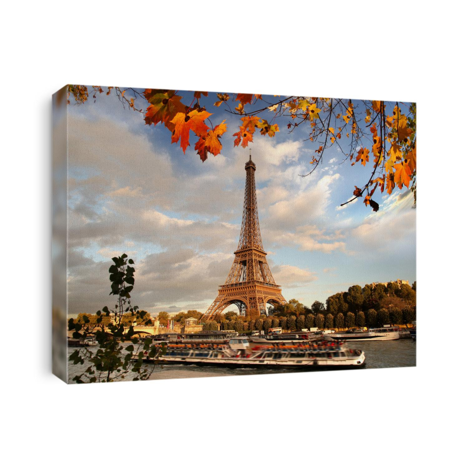 Eiffel Tower with autumn leaves in Paris, France