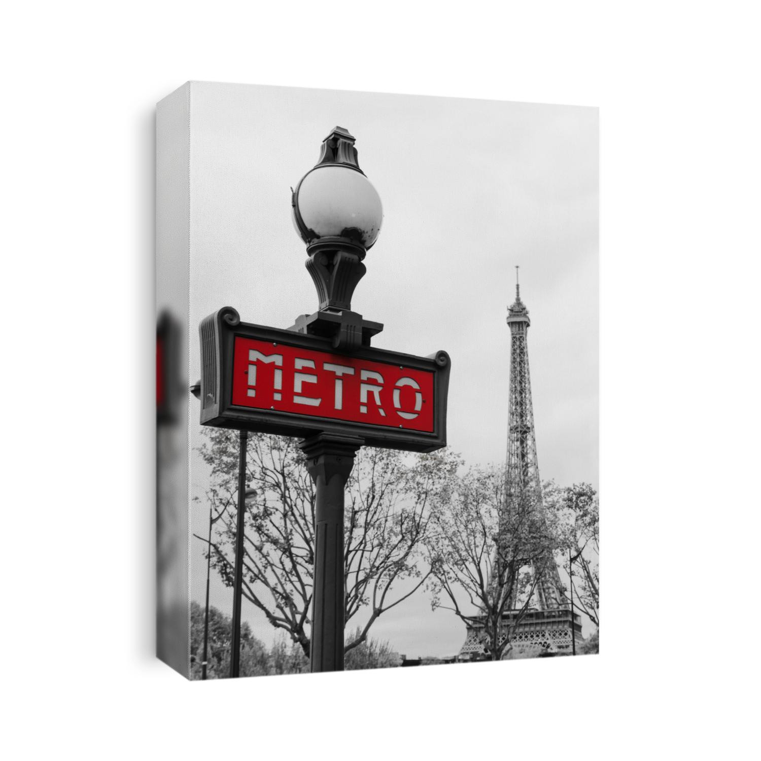 Red Paris metro subway entry sign with Eiffel tower in the background, Paris, France 