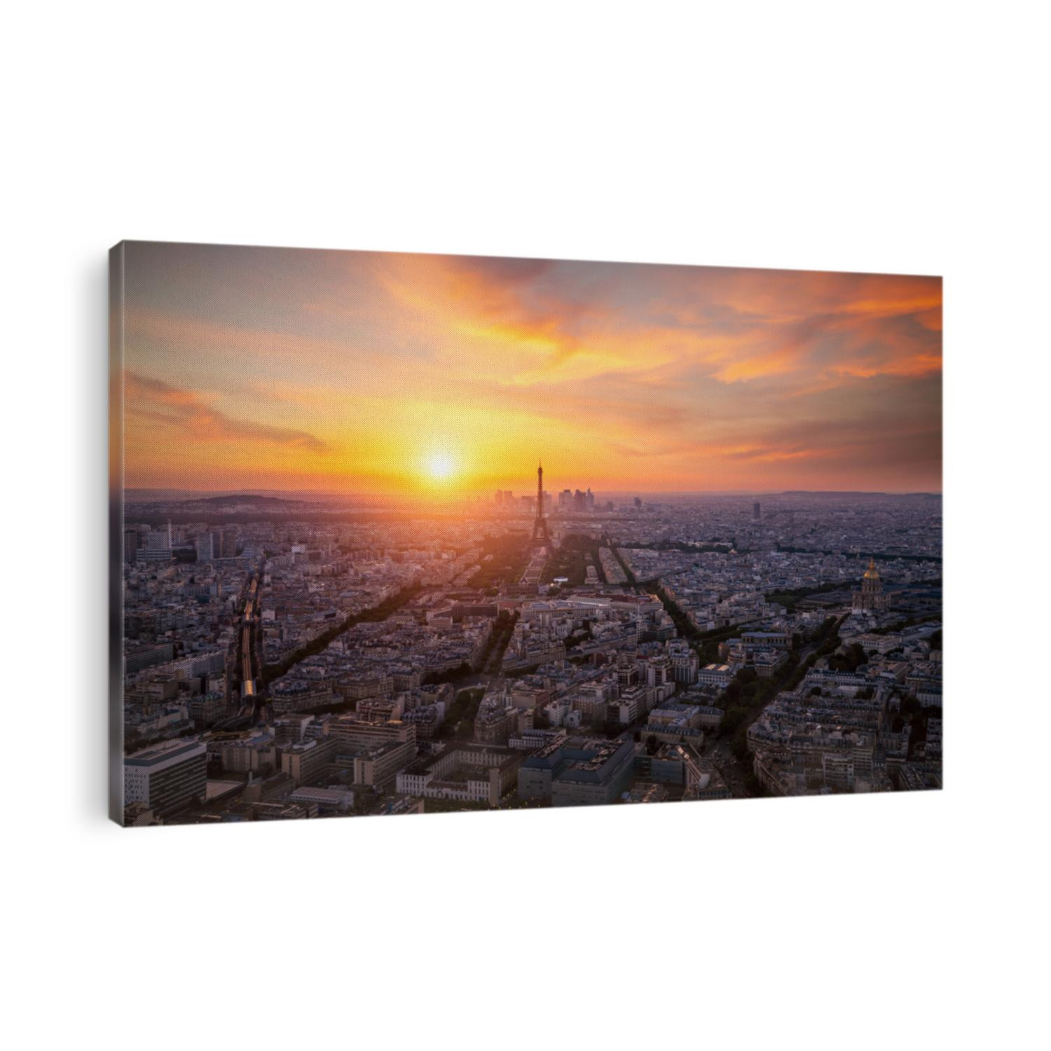 Aerial view, from Montparnasse tower at sunset and night sky, view of the Eiffel Tower and La Defense district in Paris, France
