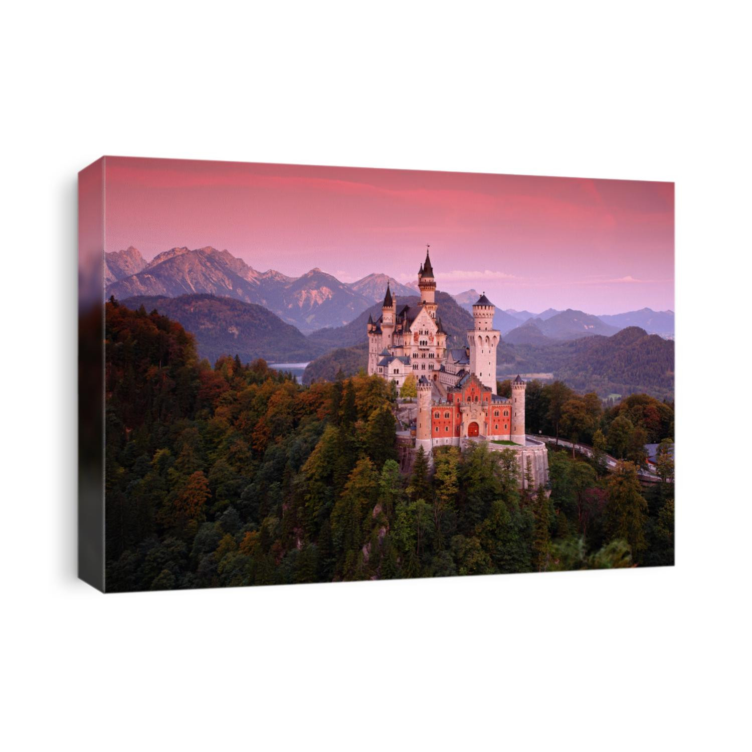 Beautiful evening view of the Neuschwanstein castle, with autumn colors after sunset, Bavarian Alps in Bavaria, Germany.