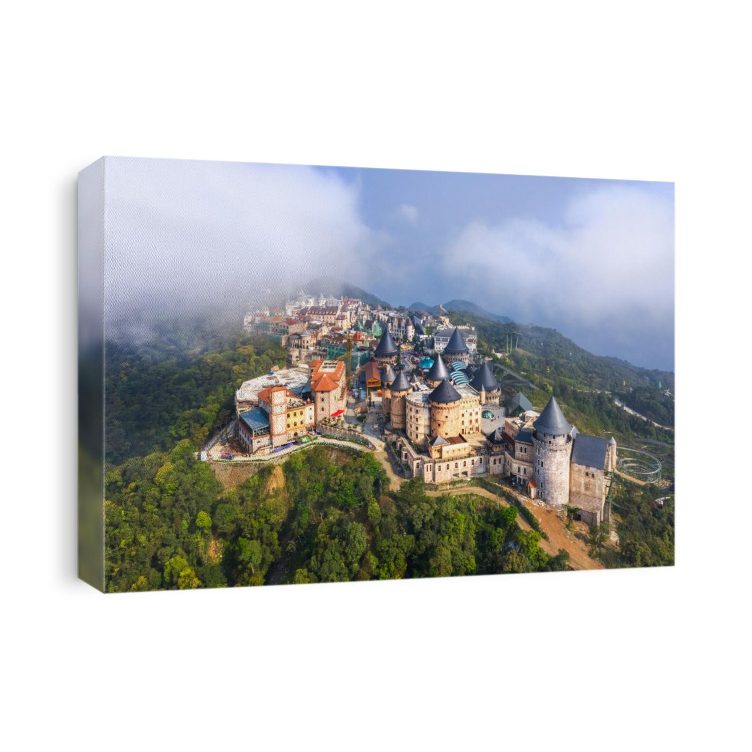 Aerial view of landscape is castles covered with fog at the top of Bana Hills, the famous tourist destination of Da Nang, Vietnam. Near Golden bridge.