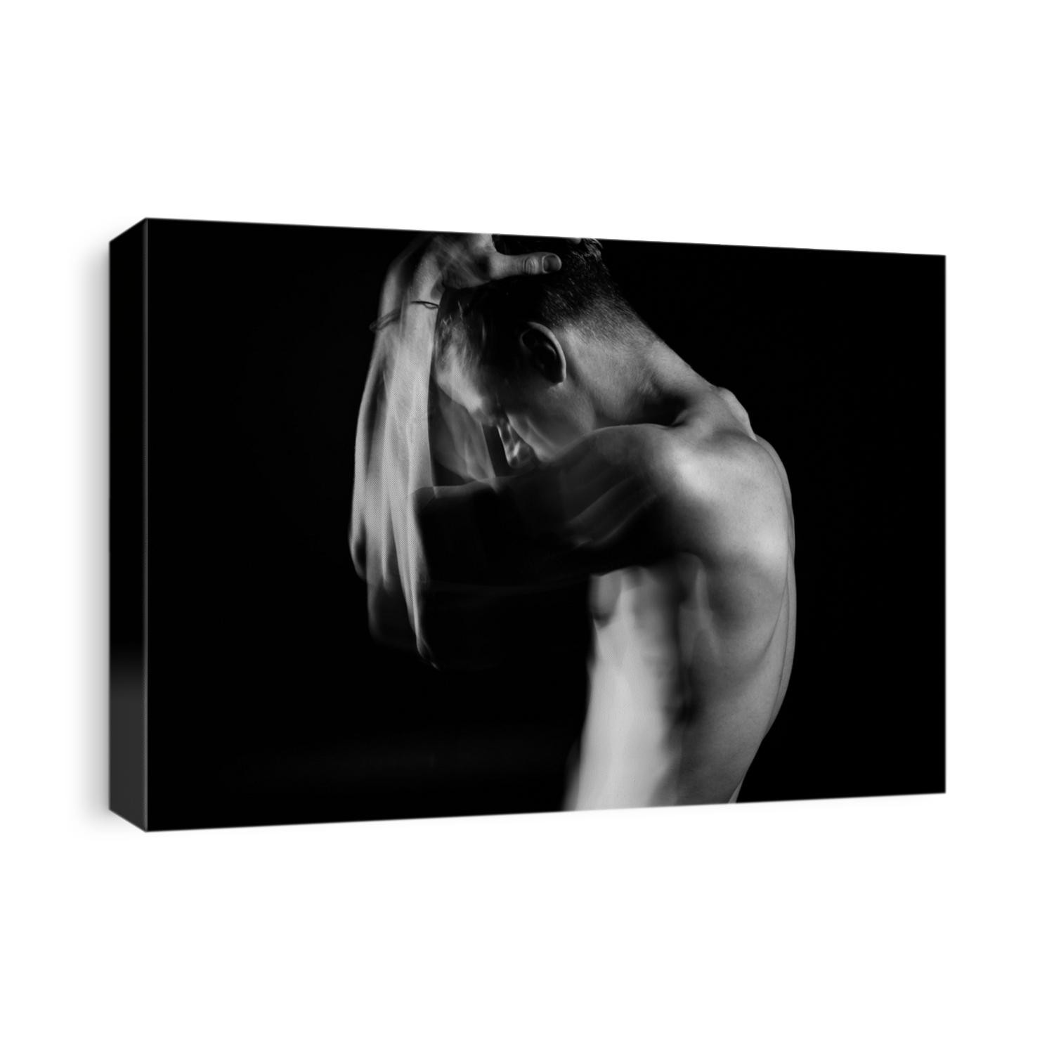 struggling with doubt and suffering. Man holding his head with hands. Profile of young naked guy. Black and white long exposure creative portrait. sports lateral muscles of the chest Original artistic
