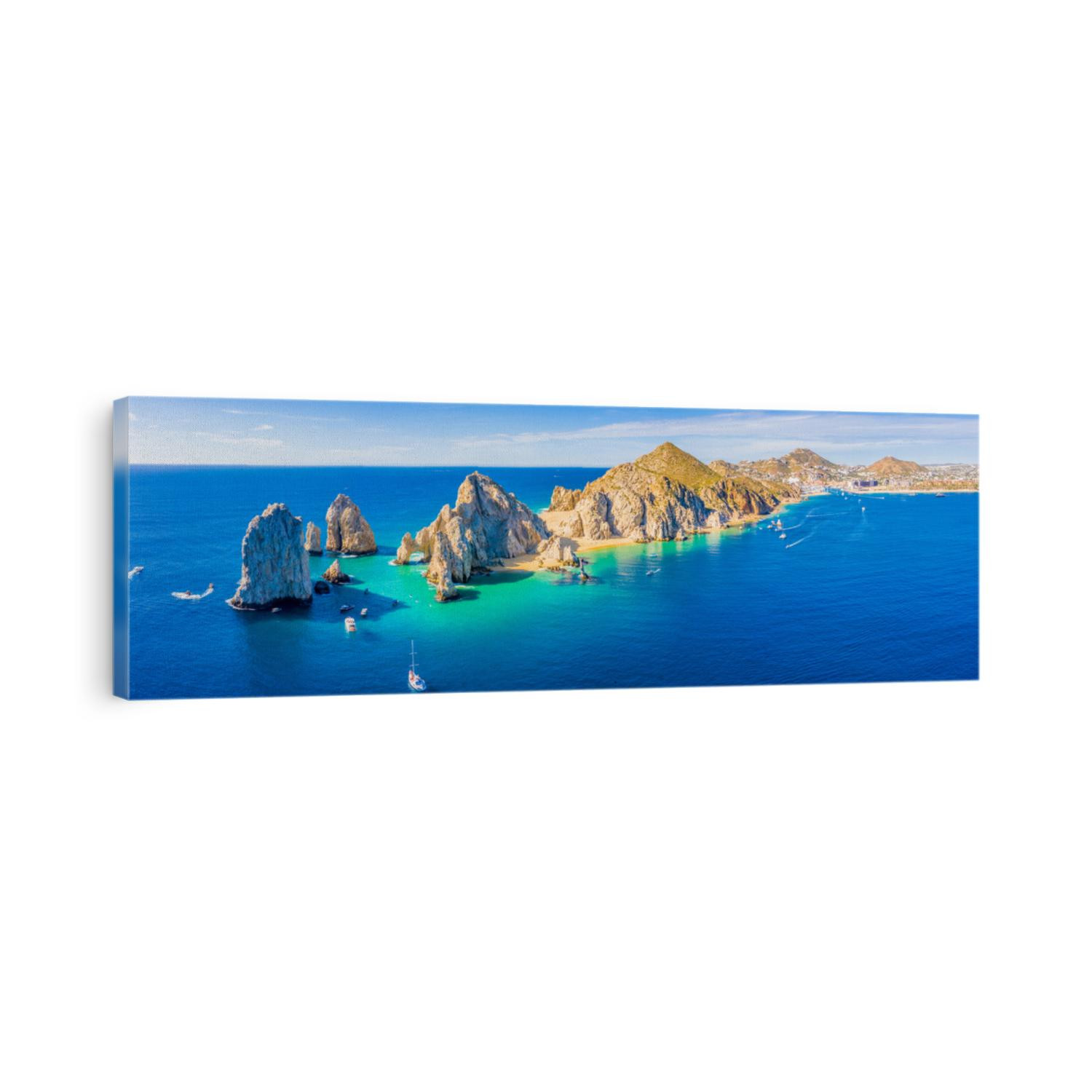 Aerial panoramic view of Lands End and El Arco at the tip of Baja California Sur, with the Cabo San Lucas, Mexico marina in the background