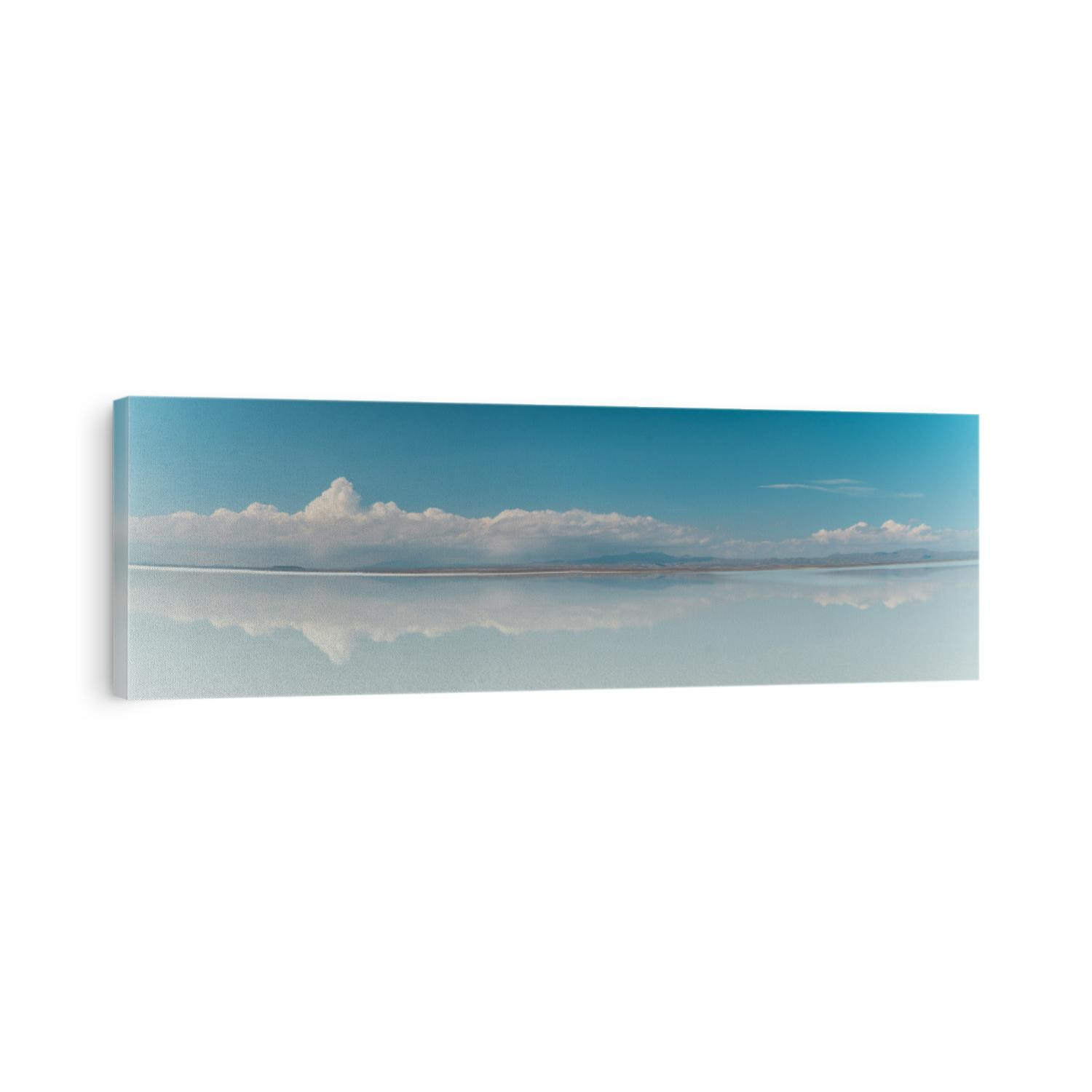 Beautiful mirror reflection on blue sky and cloud on Bolivia's Salt Flats. Shot in Salar de Uyuni salt flat. Water reflection of clouds and empty space. Holiday, vacation, freedom scene with horizon. 