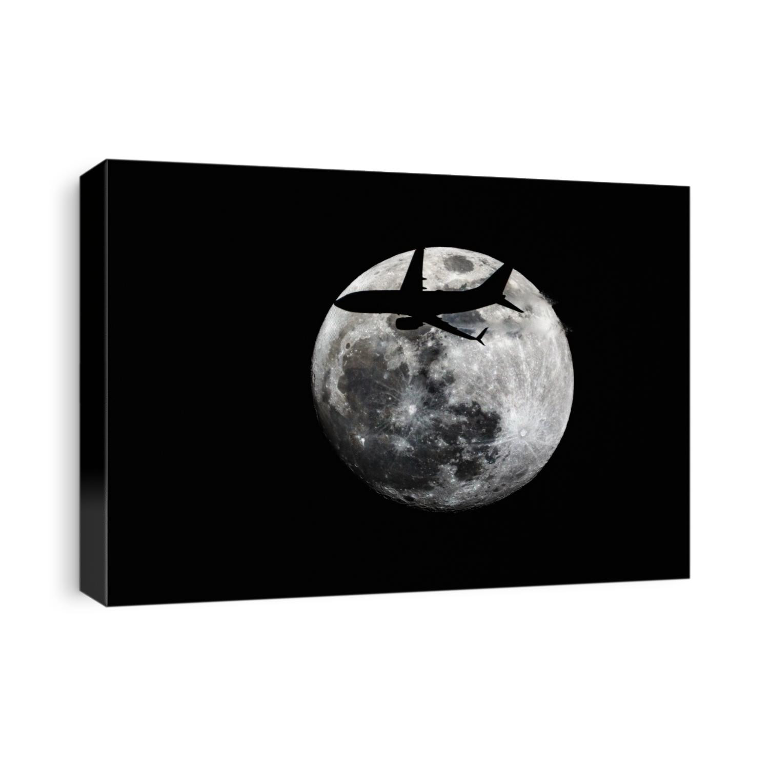 A full moon and a passenger plane in flight.